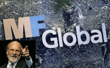 Jon Corzine, leading risk mangement failure examples, in front of the MF Global logo.png