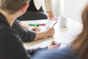 Managers considering risk factors for decision making in a meeting.jpg